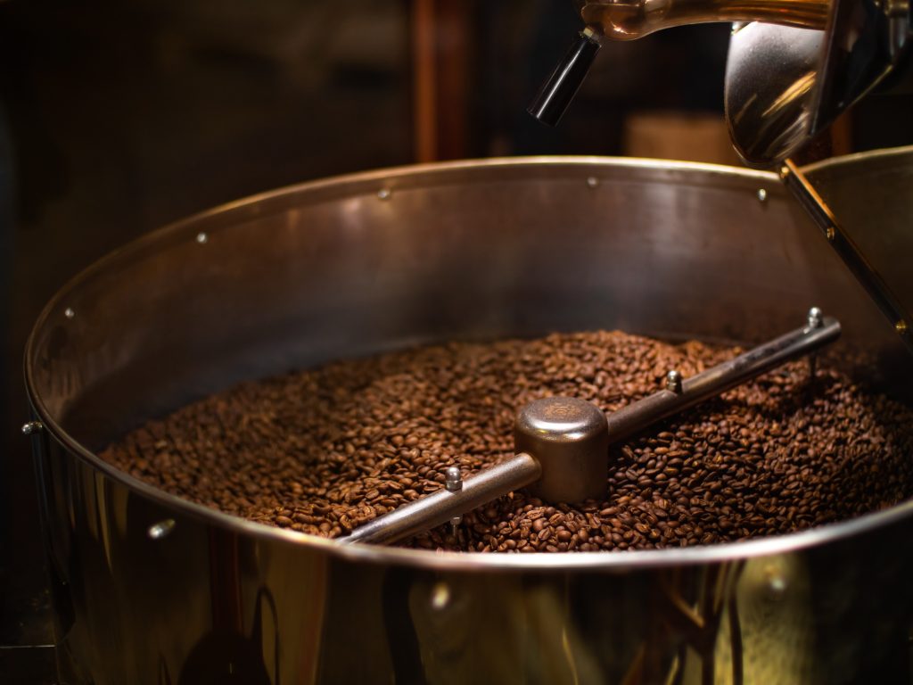 Coffee Roaster With Roasted Coffee Beans Close-up