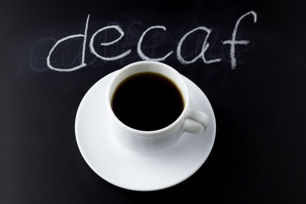 Steaming cup of decaf coffee